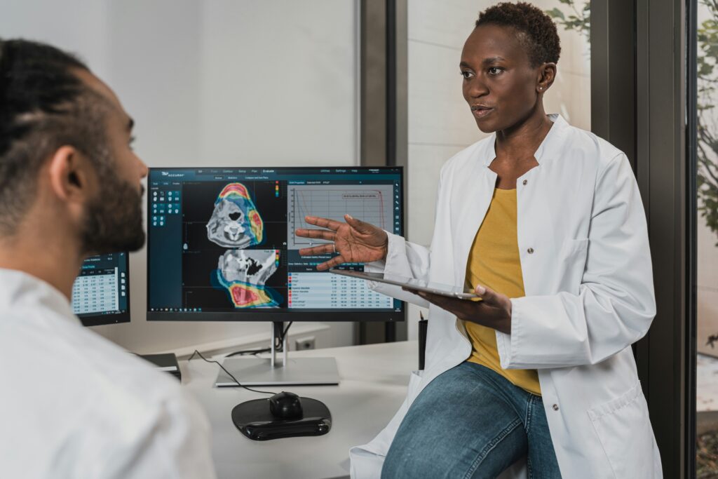 Two healthcare professionals exchanging peer feedback, demonstrating active engagement and openness to constructive criticism.