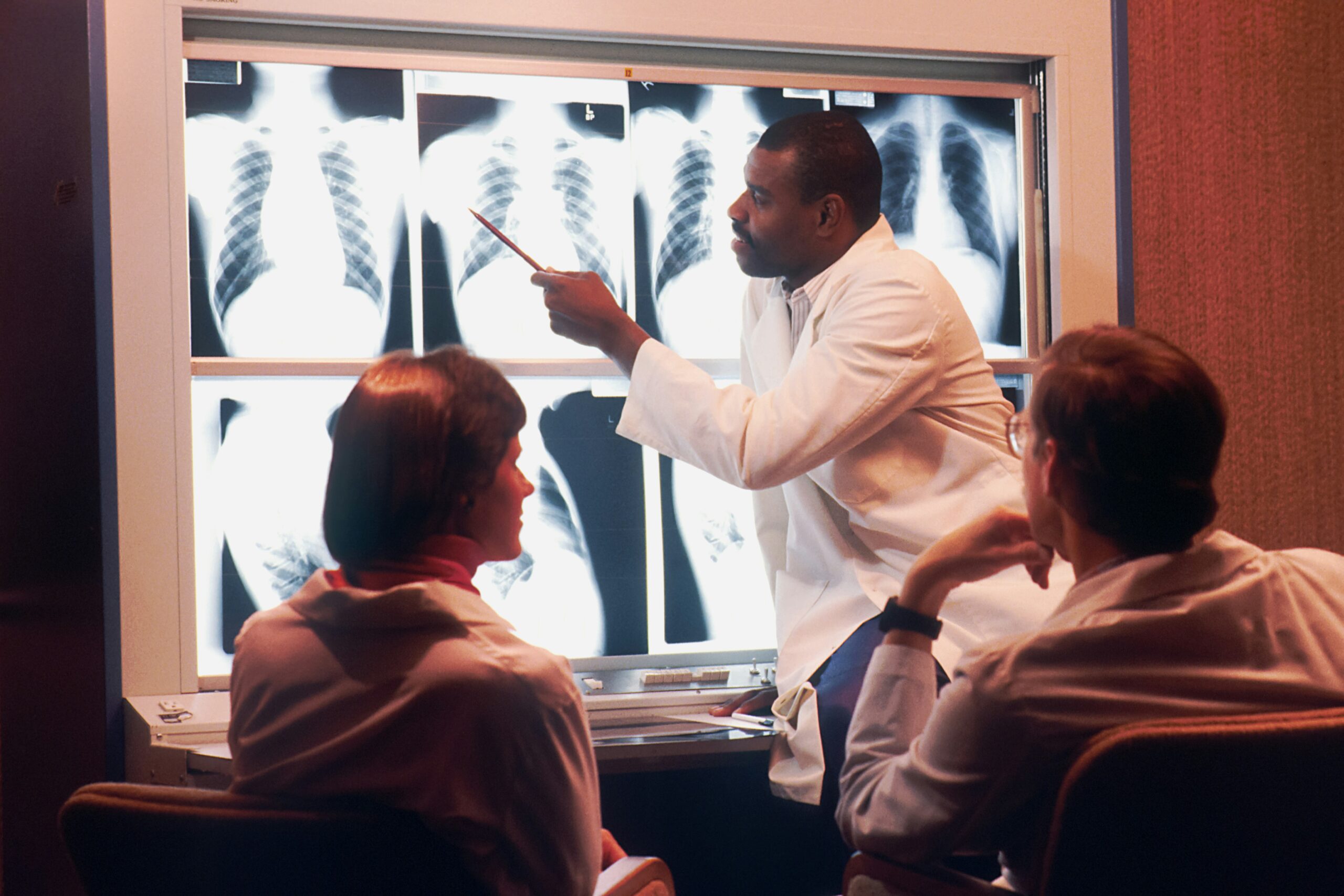 Healthcare professionals exchanging peer feedback