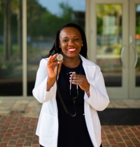 Young black nurse smiling